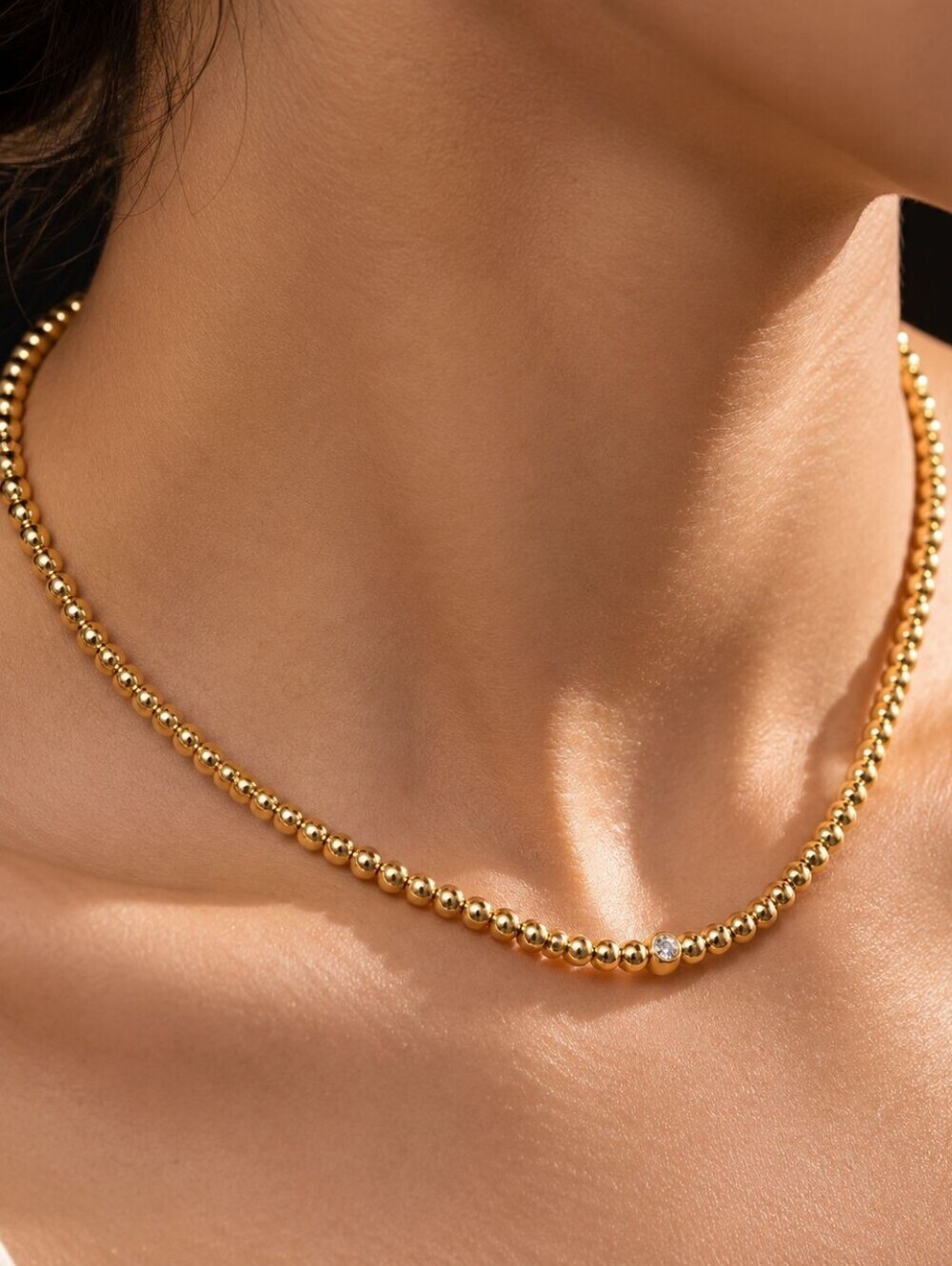 Gold Beaded Necklace with Single Crystal Accent